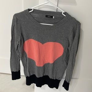 Light knit long sleeve sweater. Large pink heart in the middle